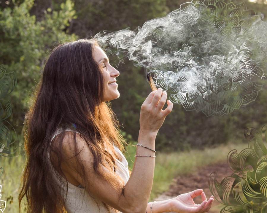 Pritam Tara holding copal smoke in an open landscape